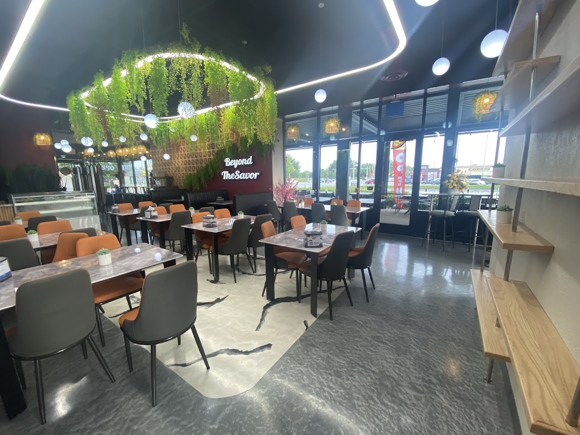 Interior dining area of Baba Saj Mediterranean Restaurant with modern decor and cozy seating.