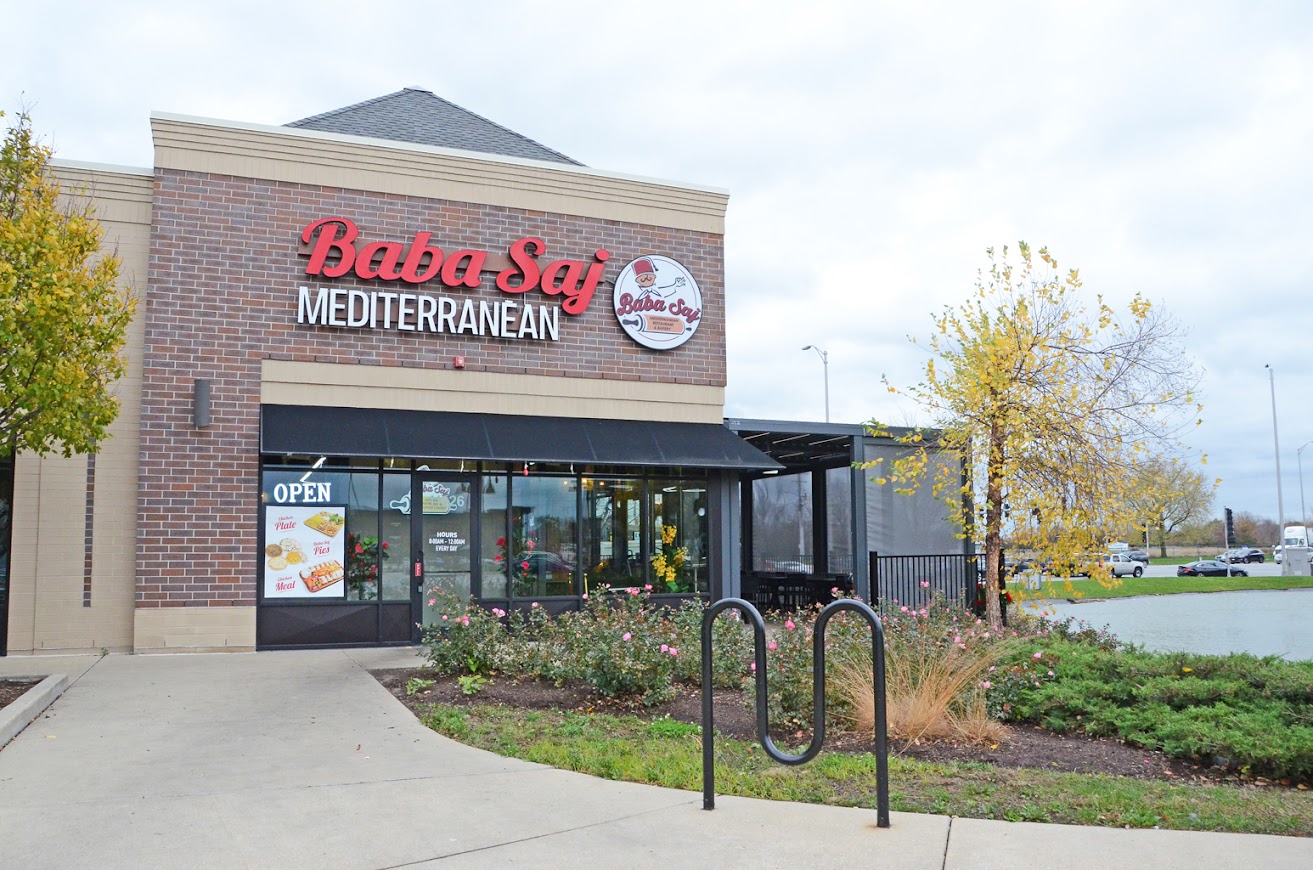 Exterior view of Baba Saj Mediterranean restaurant in Oak Lawn, showcasing the entrance and outdoor seating area.