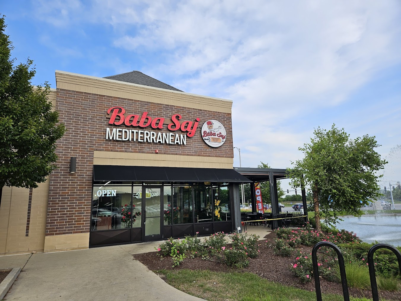 The front exterior of Baba Saj, a popular Mediterranean restaurant in Oak Lawn, Chicago, featuring its signage and outdoor patio.
